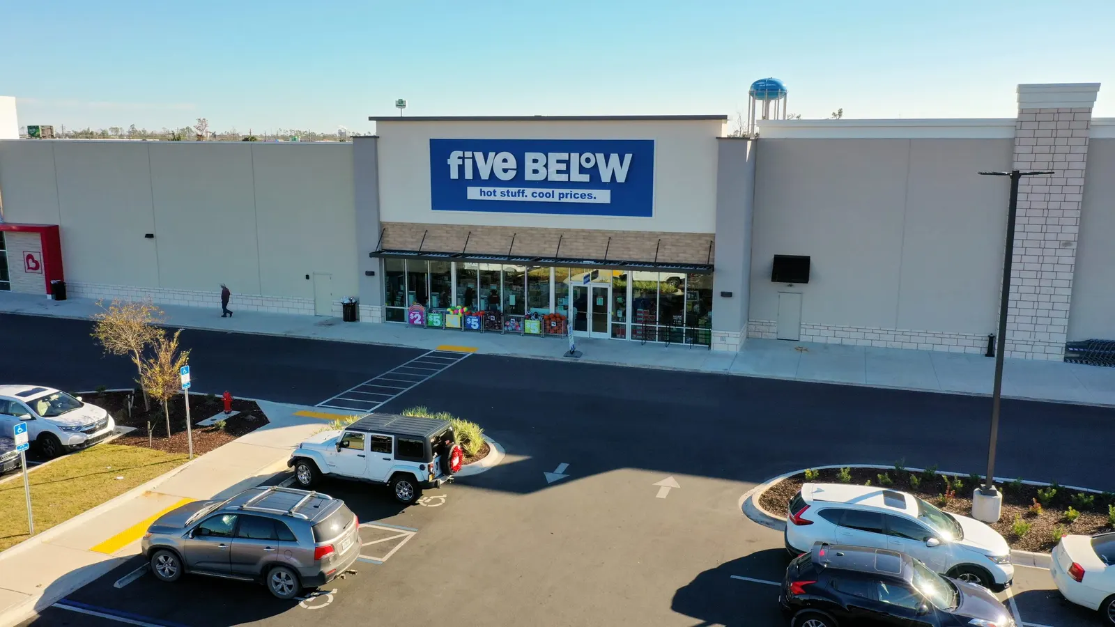 Aerial photograph of a retail building and its parking area