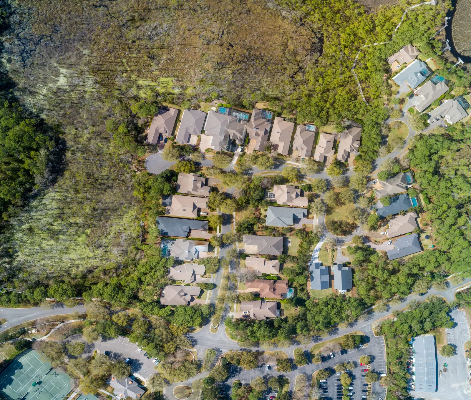Aerial view of homes and surrounding trees on Florida’s Emerald Coast