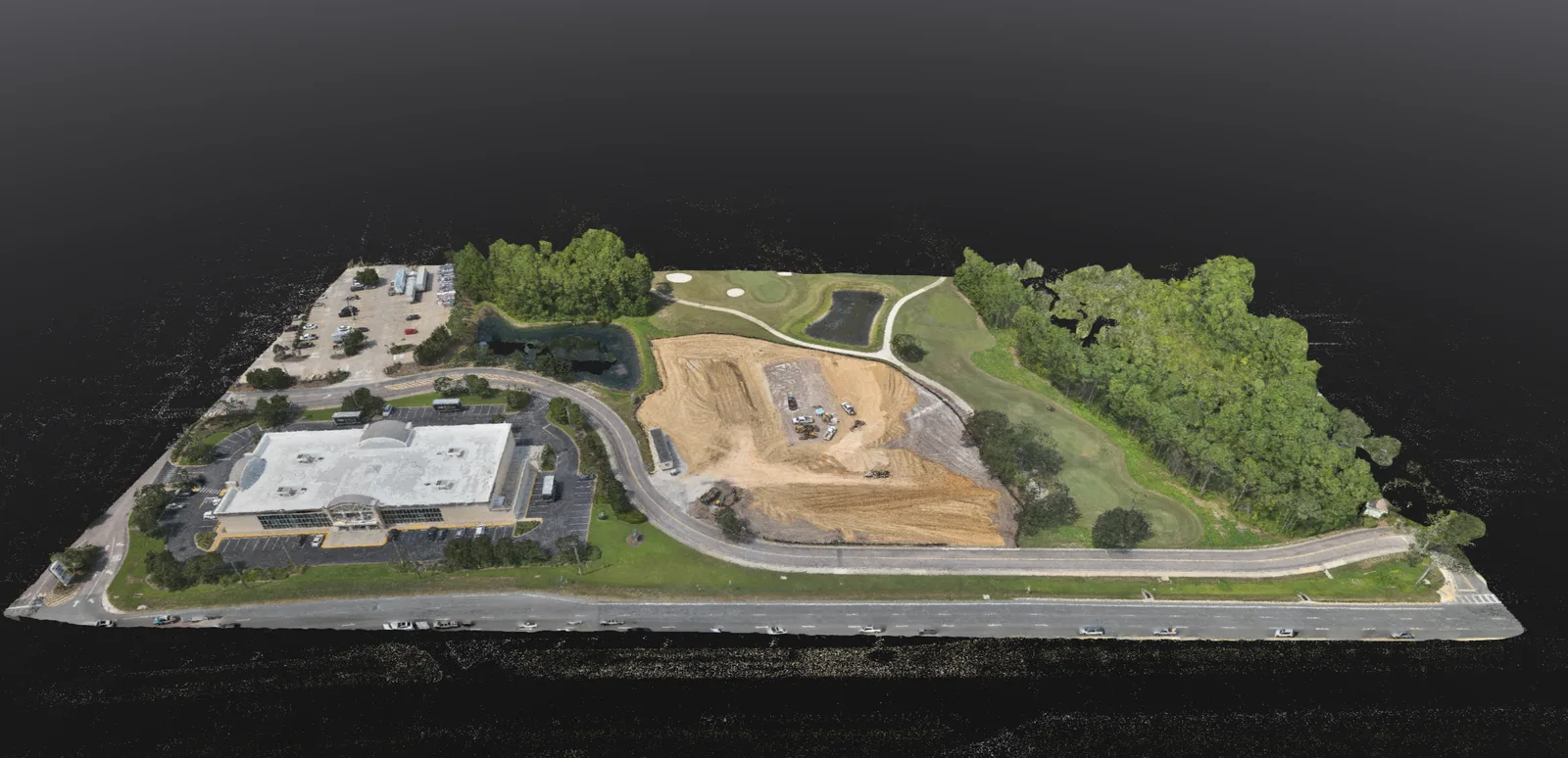 Reconstructed commercial site showing a building, cleared pad, roads and water feature