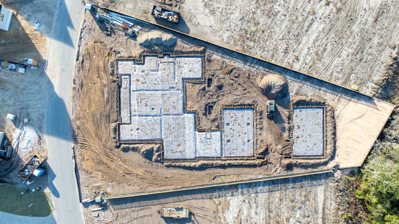Aerial view of home construction progress at Camp Creek